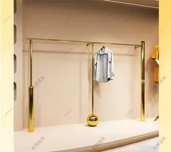 Drabužių parduotuvės vitrinos sienos kabančios grindys nerūdijančio plieno titano aukso kabančių drabužių lentyna moterų parduotuvės vitrinos lentyna